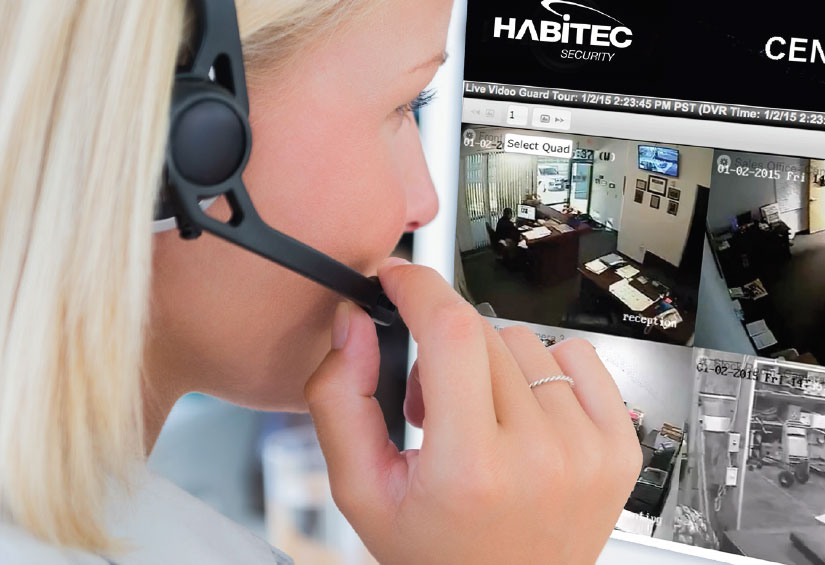 A woman monitoring a business security system provided by Habitec Security.