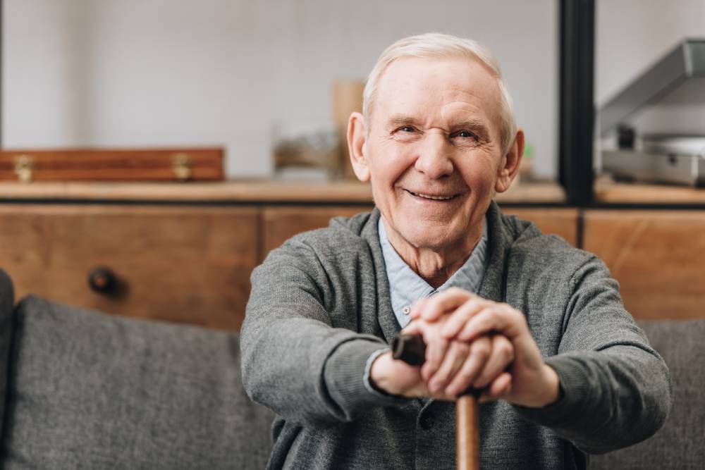 A senior enjoying his home thanks to the home security system for seniors