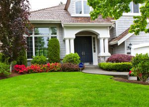 Security tips for summer in front of a house with a Habitec sign