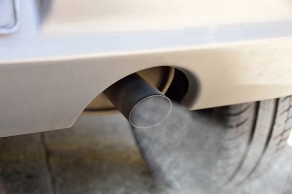 A car releasing carbon monoxide from the exhaust